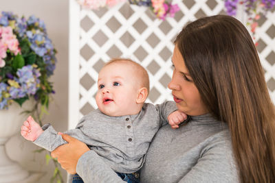 Portrait of mother holding baby