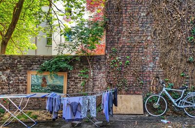 Bicycle parked against wall and building