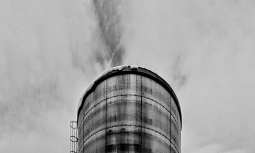 Low angle view of water tower against sky