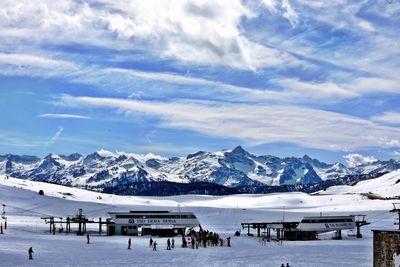 Scenic view of snowcapped mountains against sky