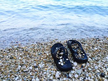 High angle view of slippers at beach