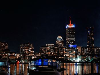 Illuminated buildings in city at night