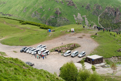 High angle view of cars on green landscape