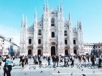 People at duomo di milano against sky