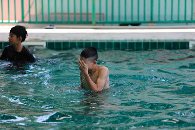 High angle view of man swimming in pool