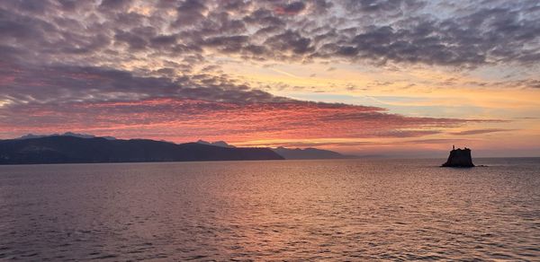 Scenic view of sea against sky during sunset