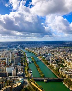 High angle view of buildings against cloudy sky