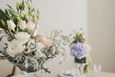 Close-up of white flower vase on table