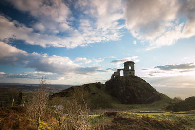 Scenic view of historical building on top of hill in countryside