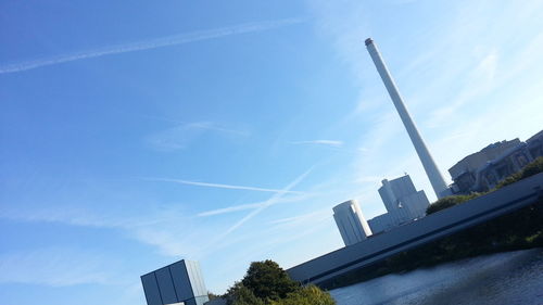 Low angle view of buildings against blue sky