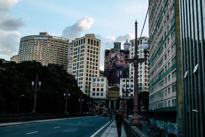 Buildings in city against sky