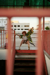 Curly redheaded young female with attitude posing in empty parking lot