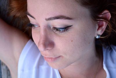 Close-up of young woman looking away