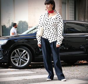 Full length of woman standing by car