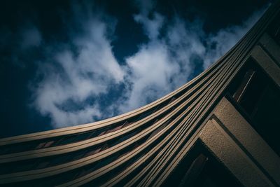 Low angle view of building against cloudy sky