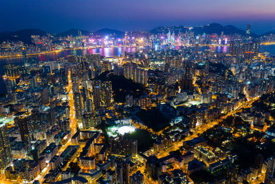 Aerial view of buildings in city at night