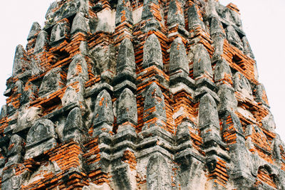 Low angle view of carving on building against sky