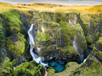 Scenic view of waterfall on mountain