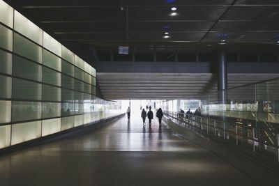 People in underground walkway of railroad station