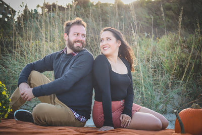 Young couple sitting in park