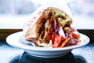 Close-up of doner kebab served in plate on table