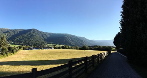 Scenic view of mountains against blue sky