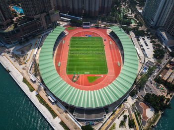 High angle view of swimming pool by buildings in city