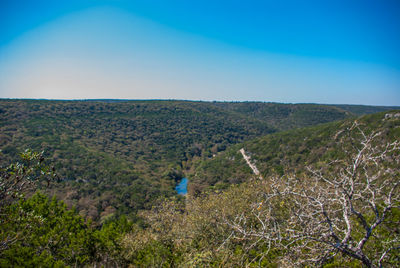 Scenic view of landscape against blue sky