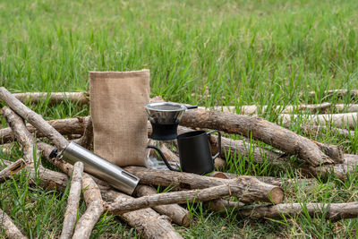 High angle view of wooden logs on field