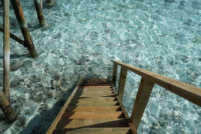 High angle view of steps by swimming pool