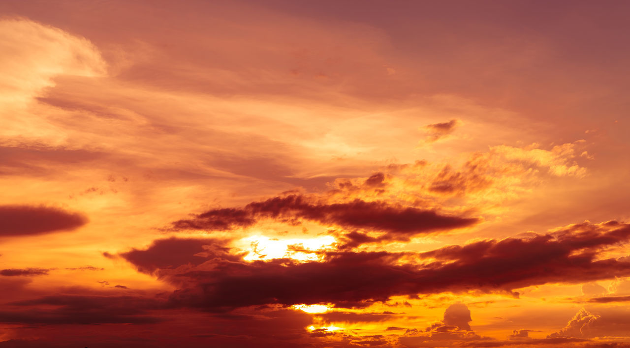 LOW ANGLE VIEW OF ORANGE CLOUDS IN SKY