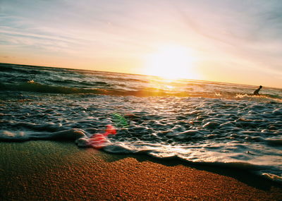 Scenic view of sea at sunset