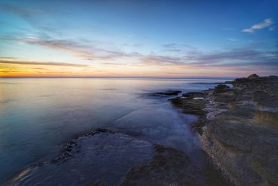 Scenic view of sea against sky during sunset