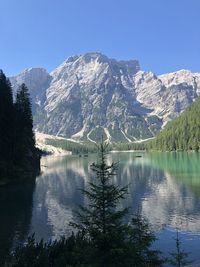 Scenic view of lake and mountains against clear sky