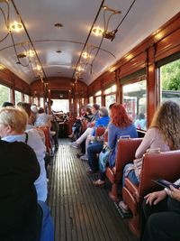 Rear view of people sitting in bus