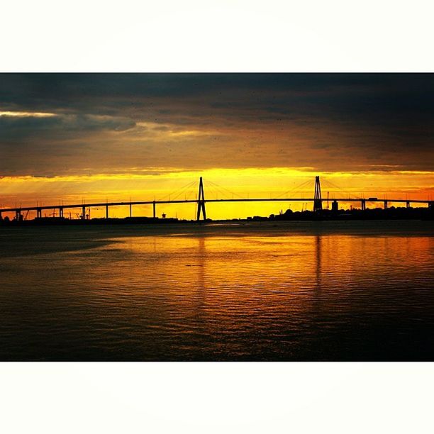 sunset, water, built structure, architecture, connection, bridge - man made structure, sky, silhouette, transfer print, orange color, bridge, waterfront, sea, tranquil scene, scenics, river, tranquility, auto post production filter, beauty in nature, engineering