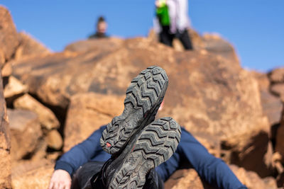 Low section of person on rock