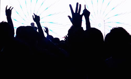 Silhouette of people in dark room