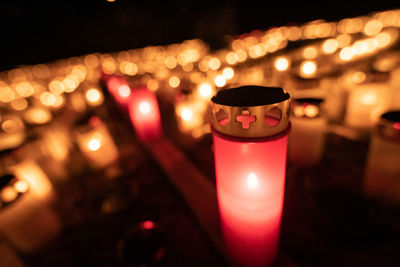 Close-up of illuminated tea light candles