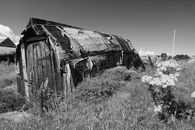 Abandoned house on field