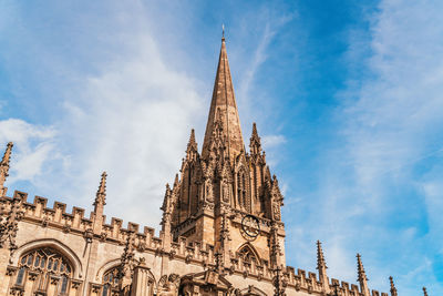 Low angle view of temple building against cloudy sky