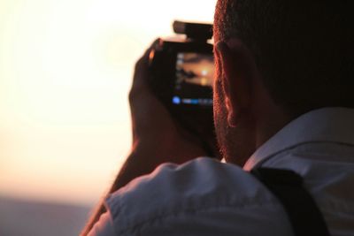 Close-up of man photographing