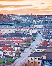 High angle shot of townscape against sky at sunset