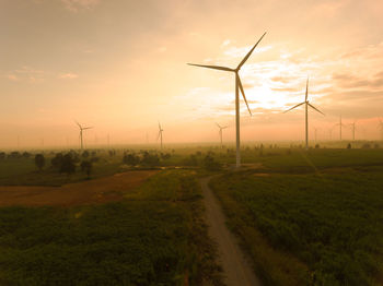 Scenic view of field against sky during sunset