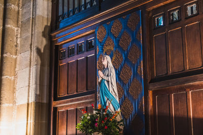 Low angle view of statue against building