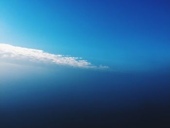 Scenic view of landscape against blue sky