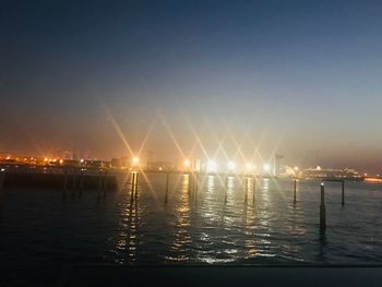 Scenic view of sea against clear sky at night