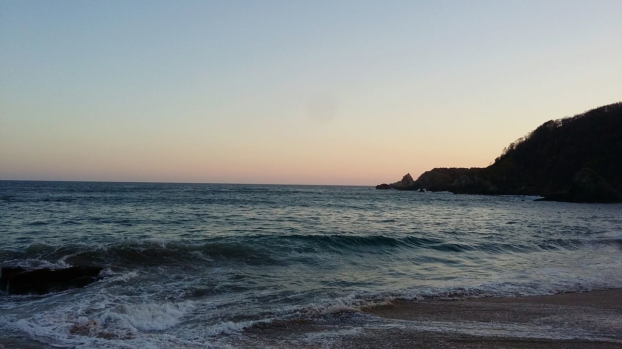 sea, horizon over water, water, sunset, beach, tranquility, beauty in nature, tranquil scene, scenics, nature, sky, clear sky, no people, outdoors, day