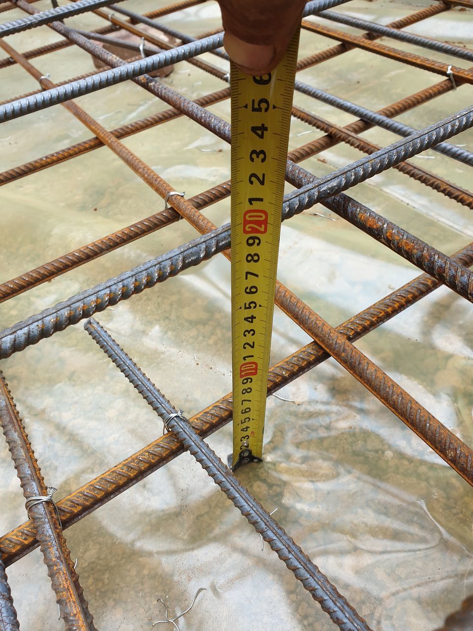 HIGH ANGLE VIEW OF INFORMATION SIGN BOARD ON METAL RAILING