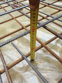 High angle view of information sign on metal railing